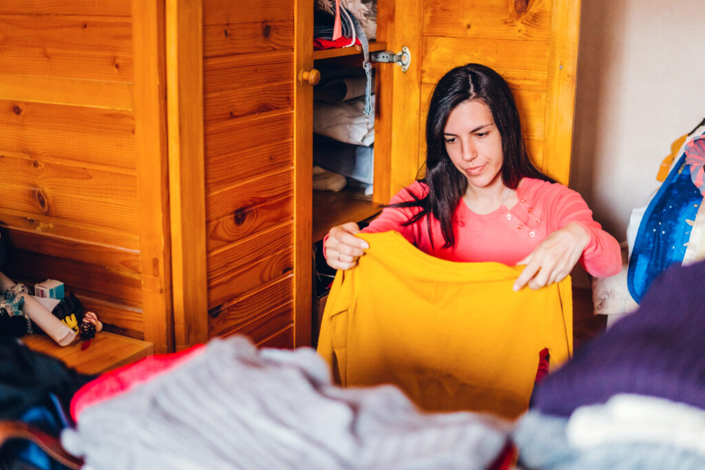 Woman sorting out wardrobe